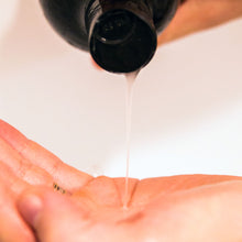 Load image into Gallery viewer, Pouring shampoo showing light clear consistency